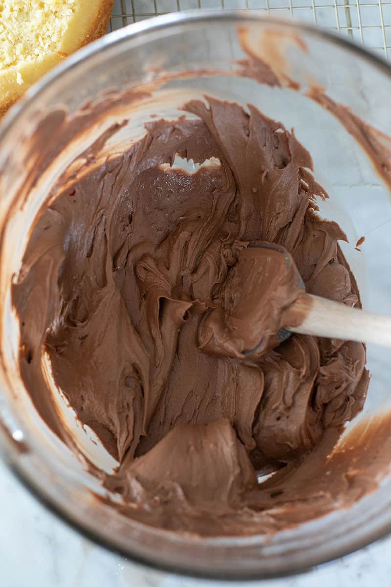 Chocolate frosting whipped in a mixing bowl. 