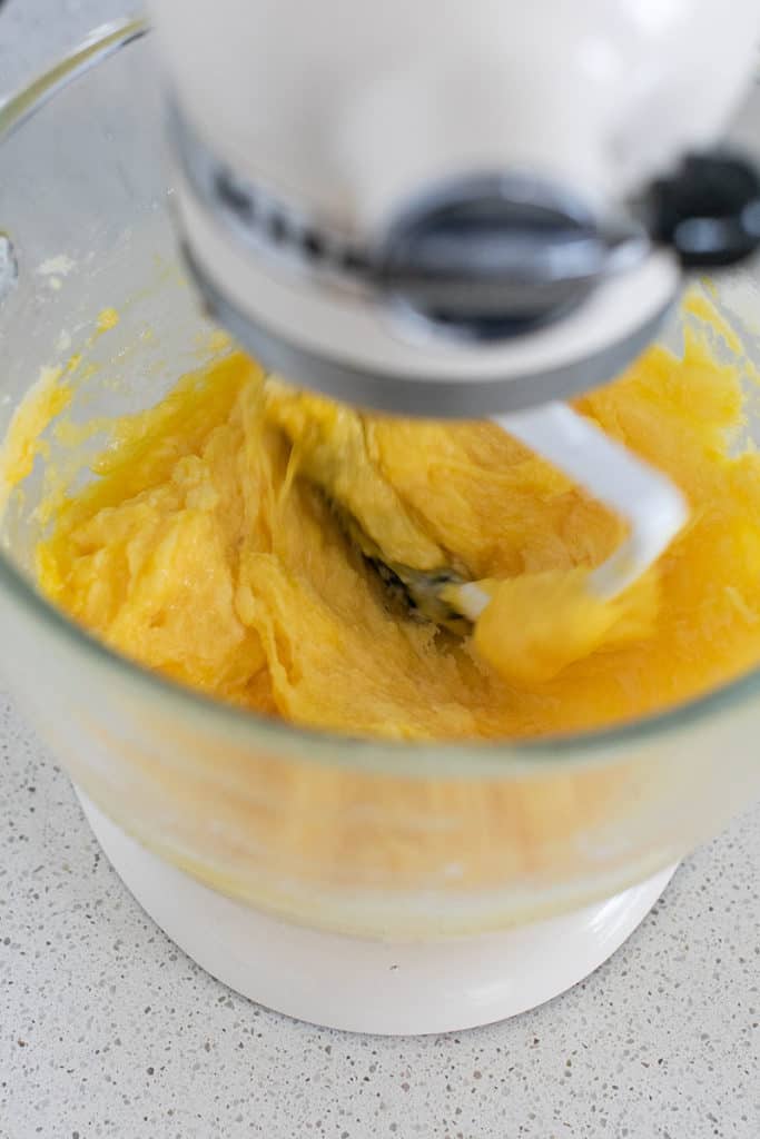 Whipping birthday cake batter in a mixer.