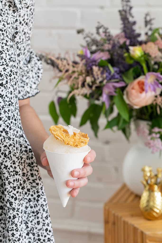 Snow cone bar with pineapple garnish.