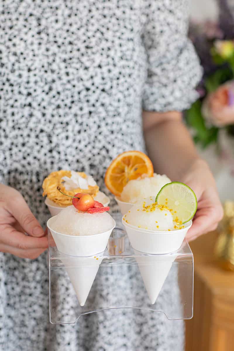 Snow cones in a snow cone holder. 