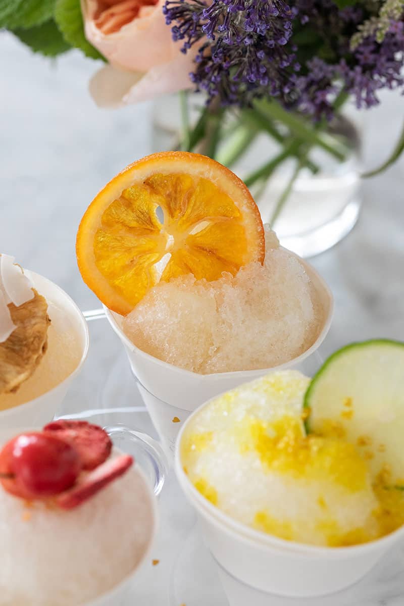 Snow cones in a hole with fruit