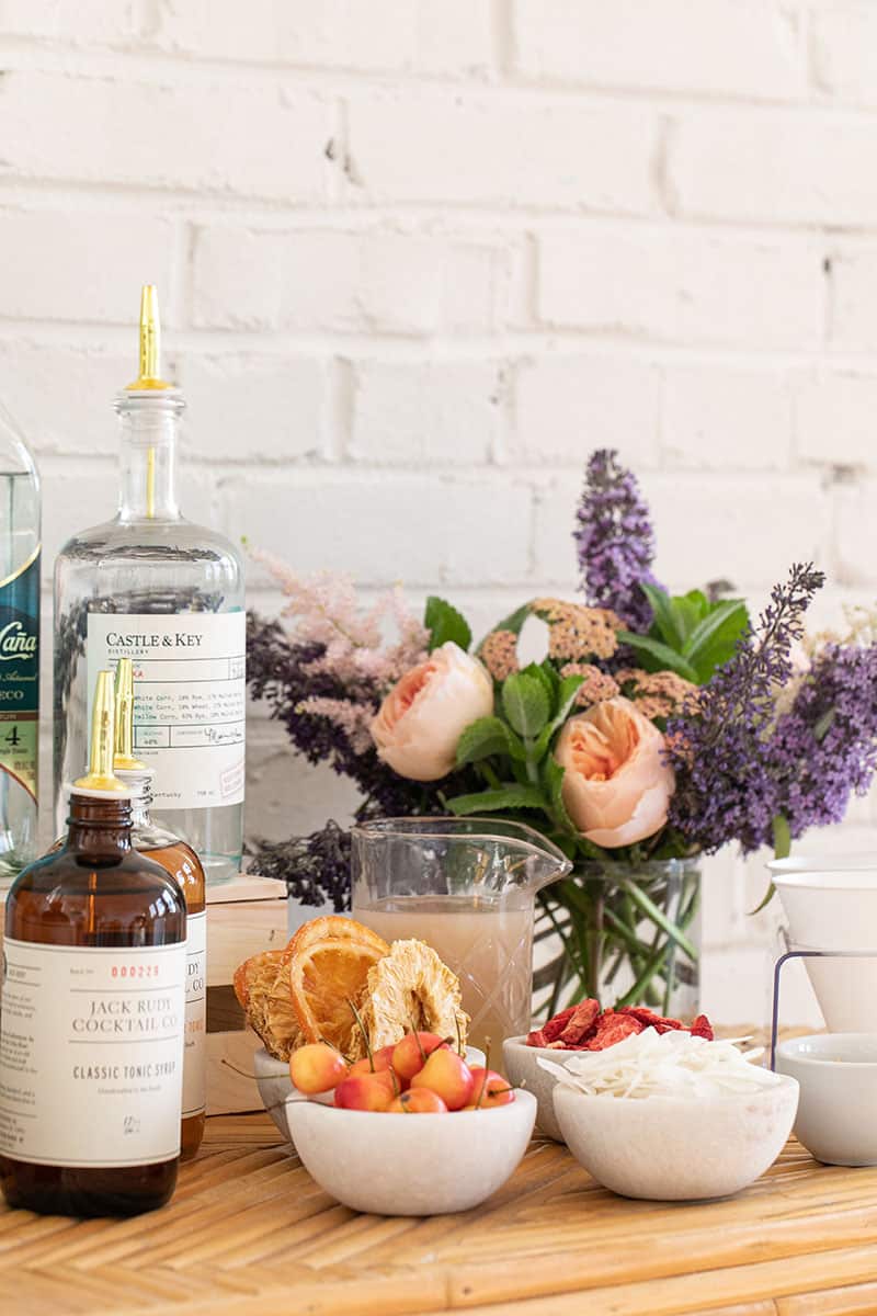 Toppings and flowers on a bar.