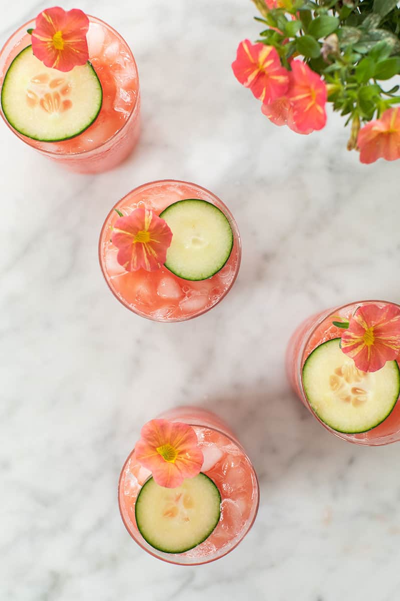 Watermelon and cucumber cooler in glasses on a marble table.