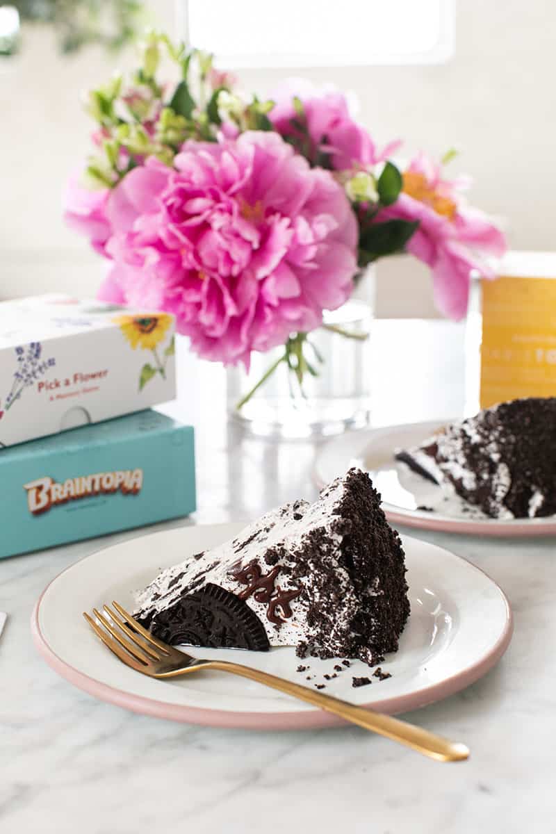 Slice of Oreo ice cream cake with Oreo crumbles. 