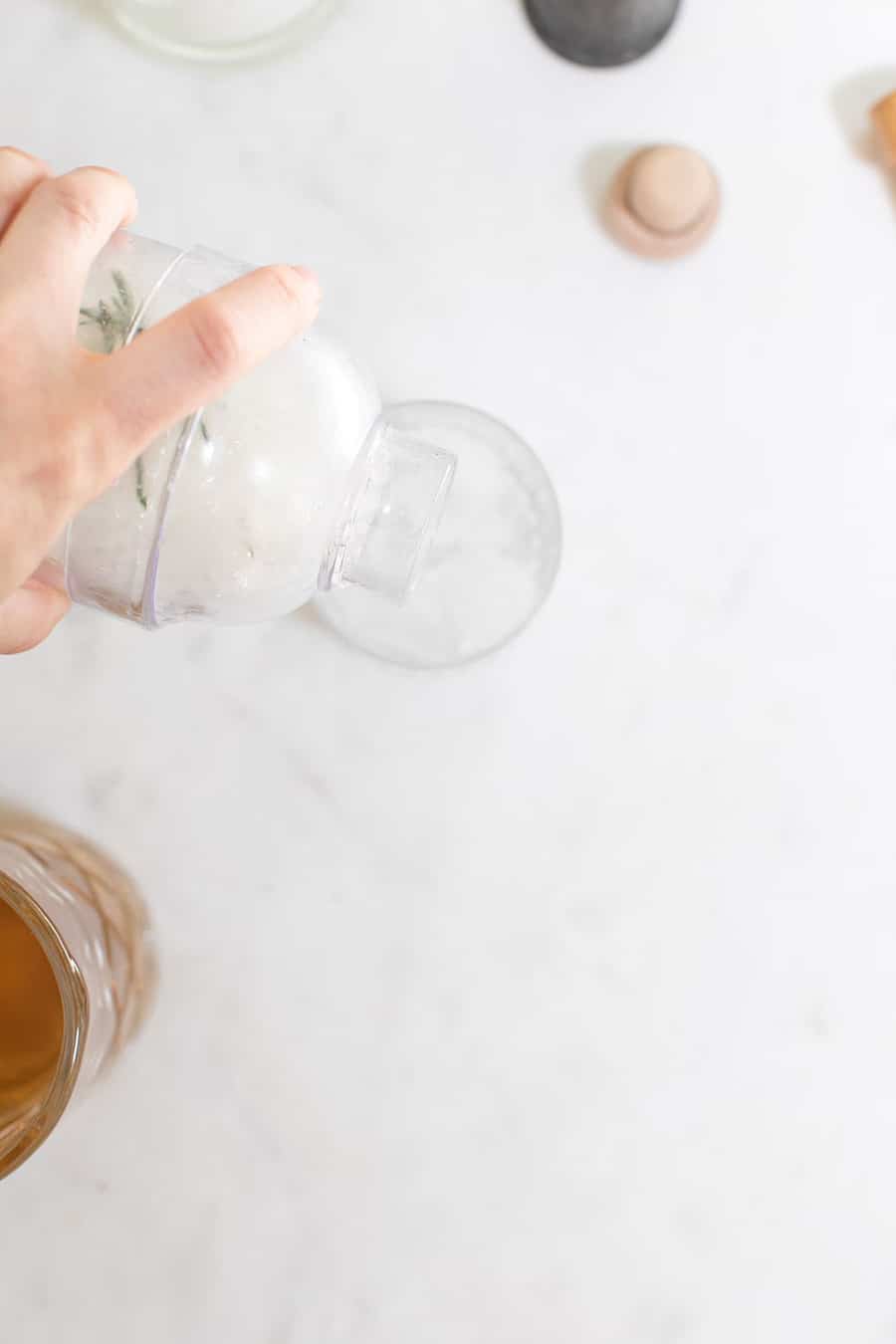 Pouring a mocktail into a glass.