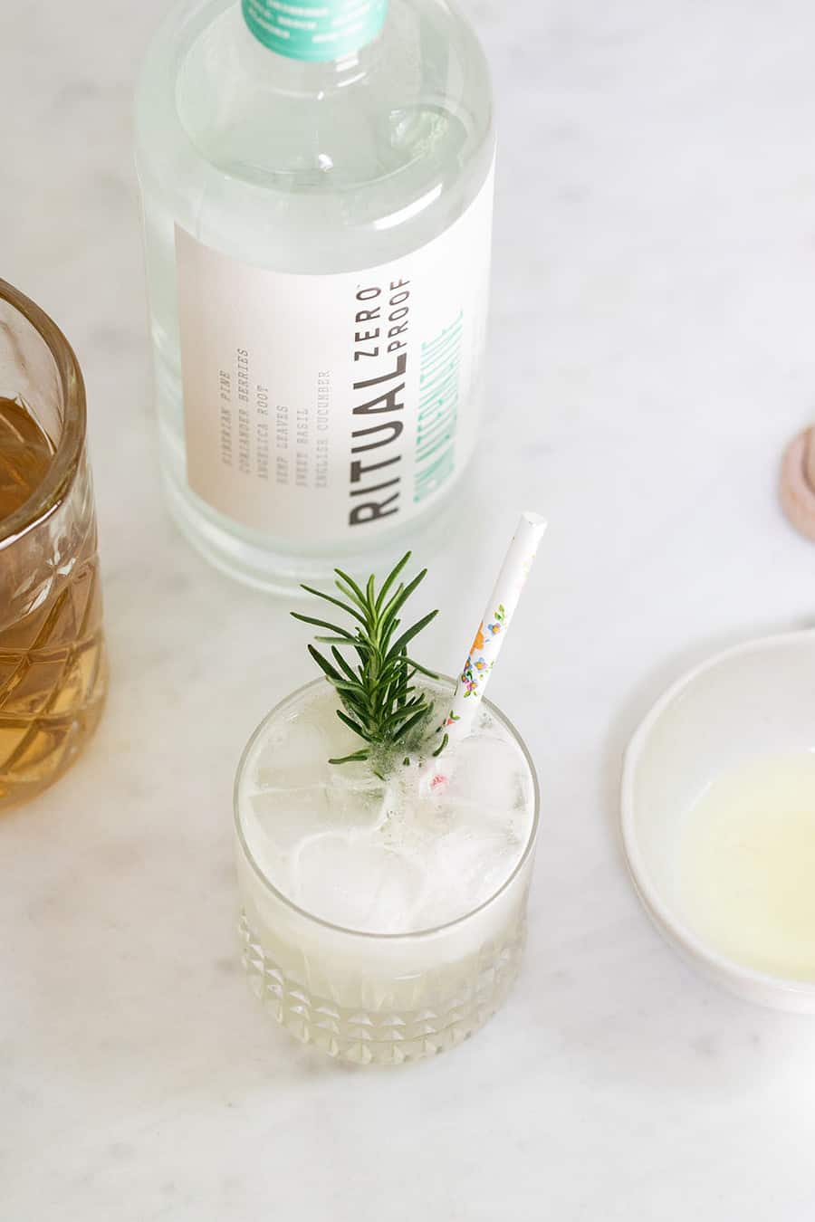 mocktail with rosemary, zero proof spirit and simple syrup.