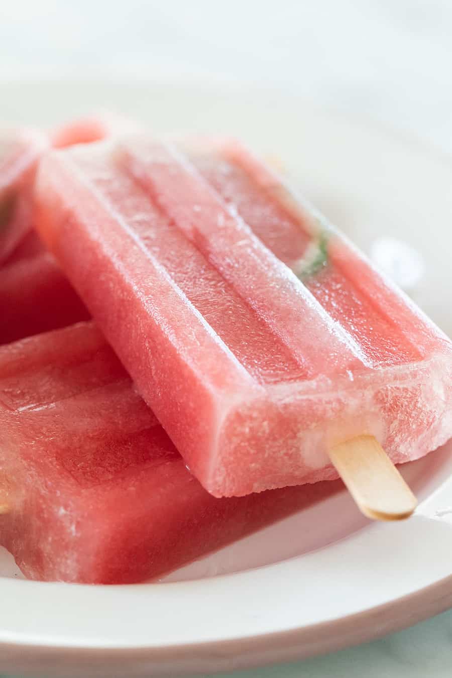 Watermelon popsicles on a plate