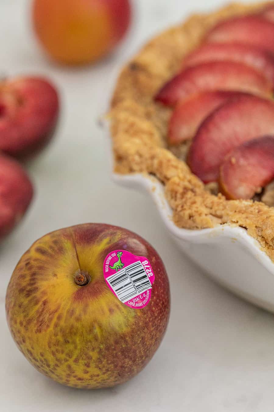 A plumcot with a pink label.