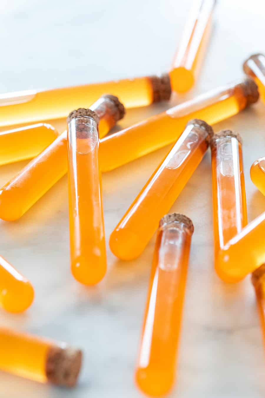 Orange vodka in test tubes 