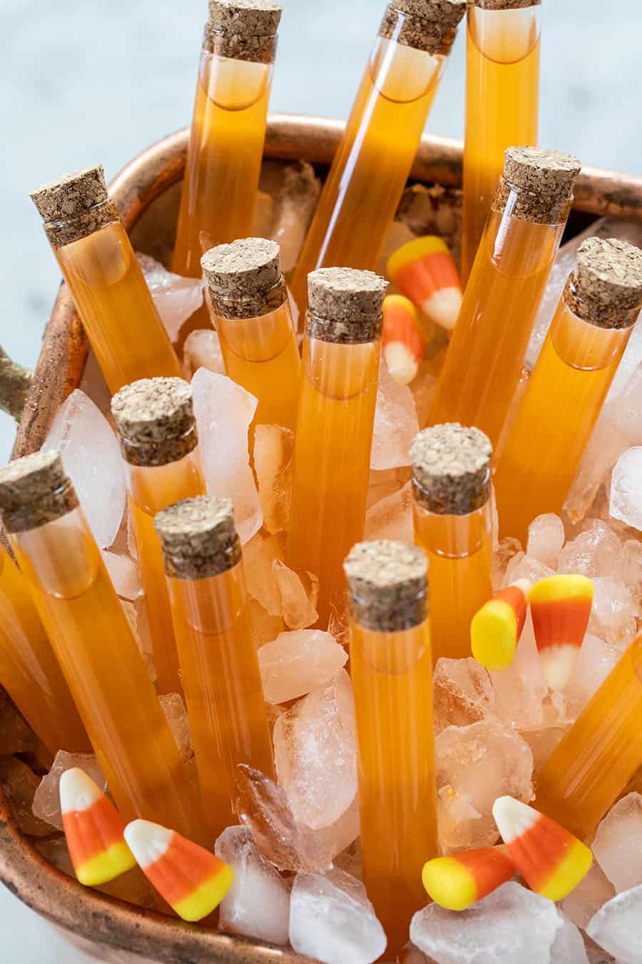 Candy corn Halloween shots in test tubes over ice.