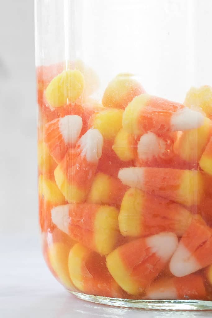 Candy corns in a jar.