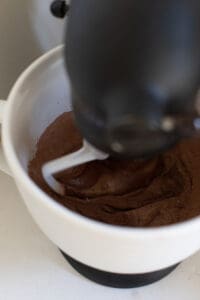 beating chocolate in an electric mixer