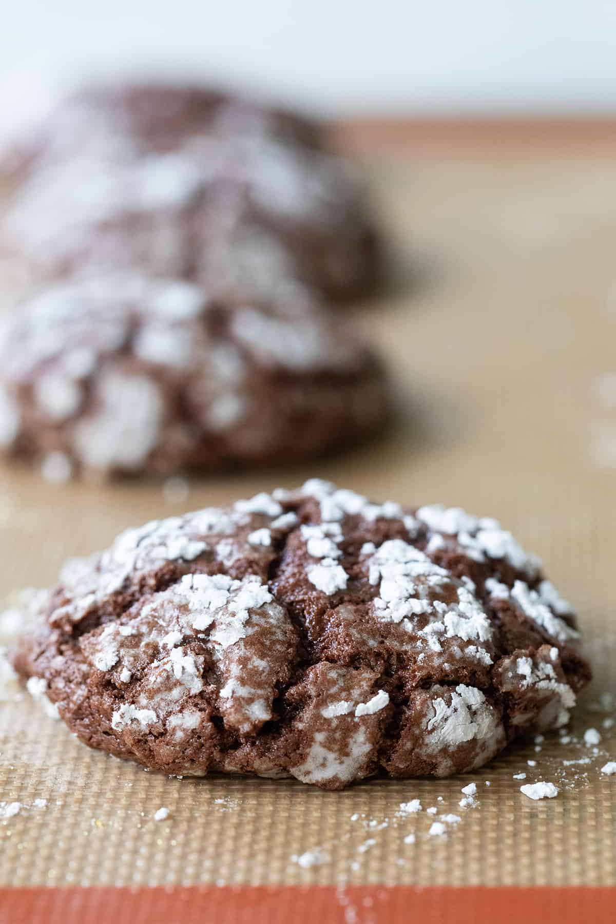 crinkle cookie baking on a prepared cookie sheet