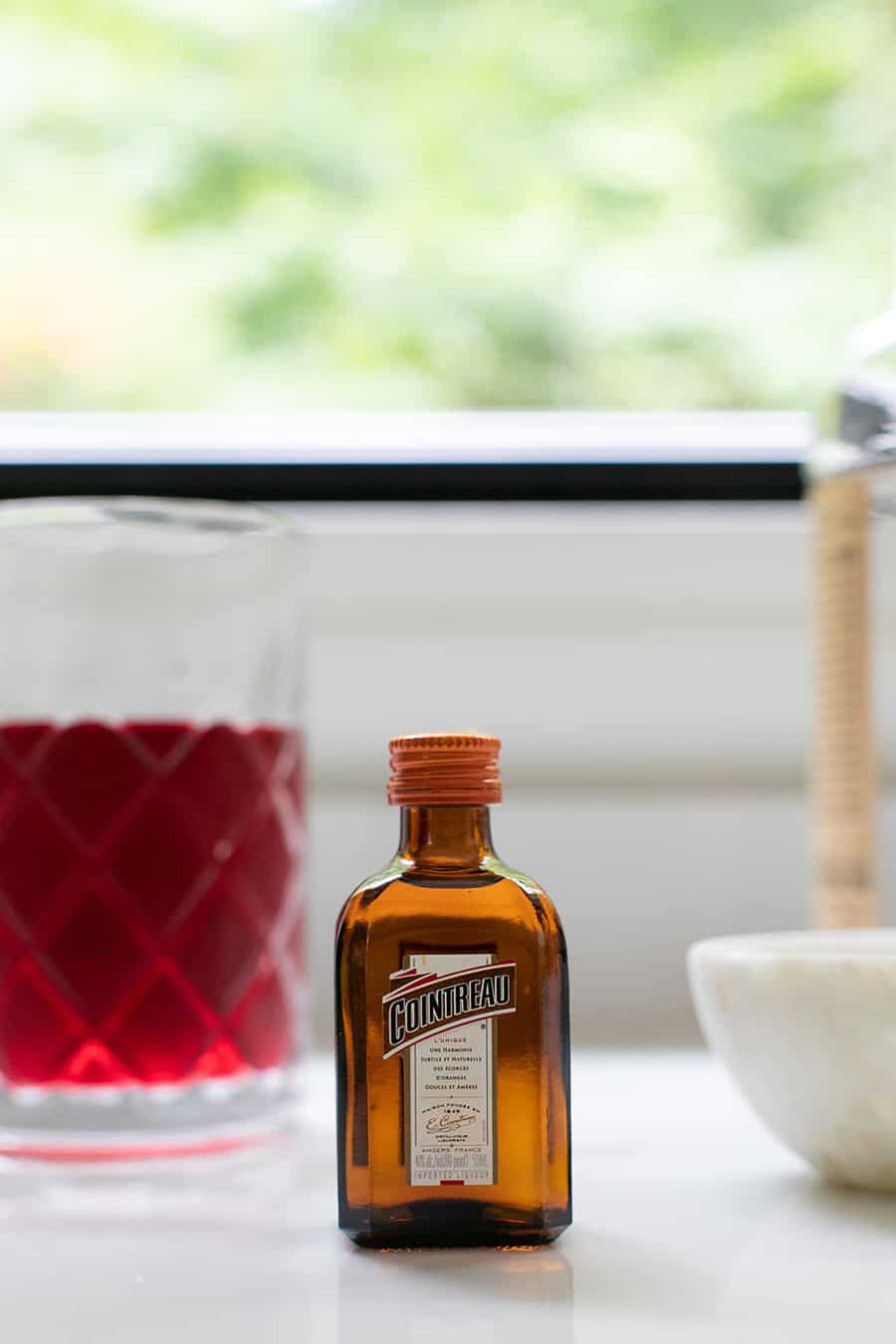 Small bottles Cointreau - sweetened cranberry juice