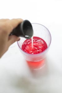 lime juice, cranberry juice in a cocktail shaker