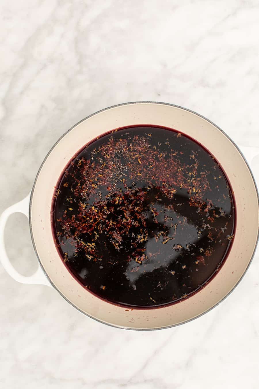 Mulled wine in a saucepan with spices