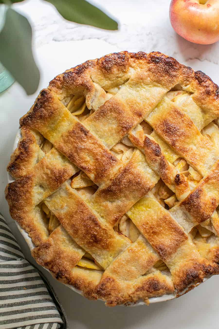 Close up of a golden brown homemade apple pie