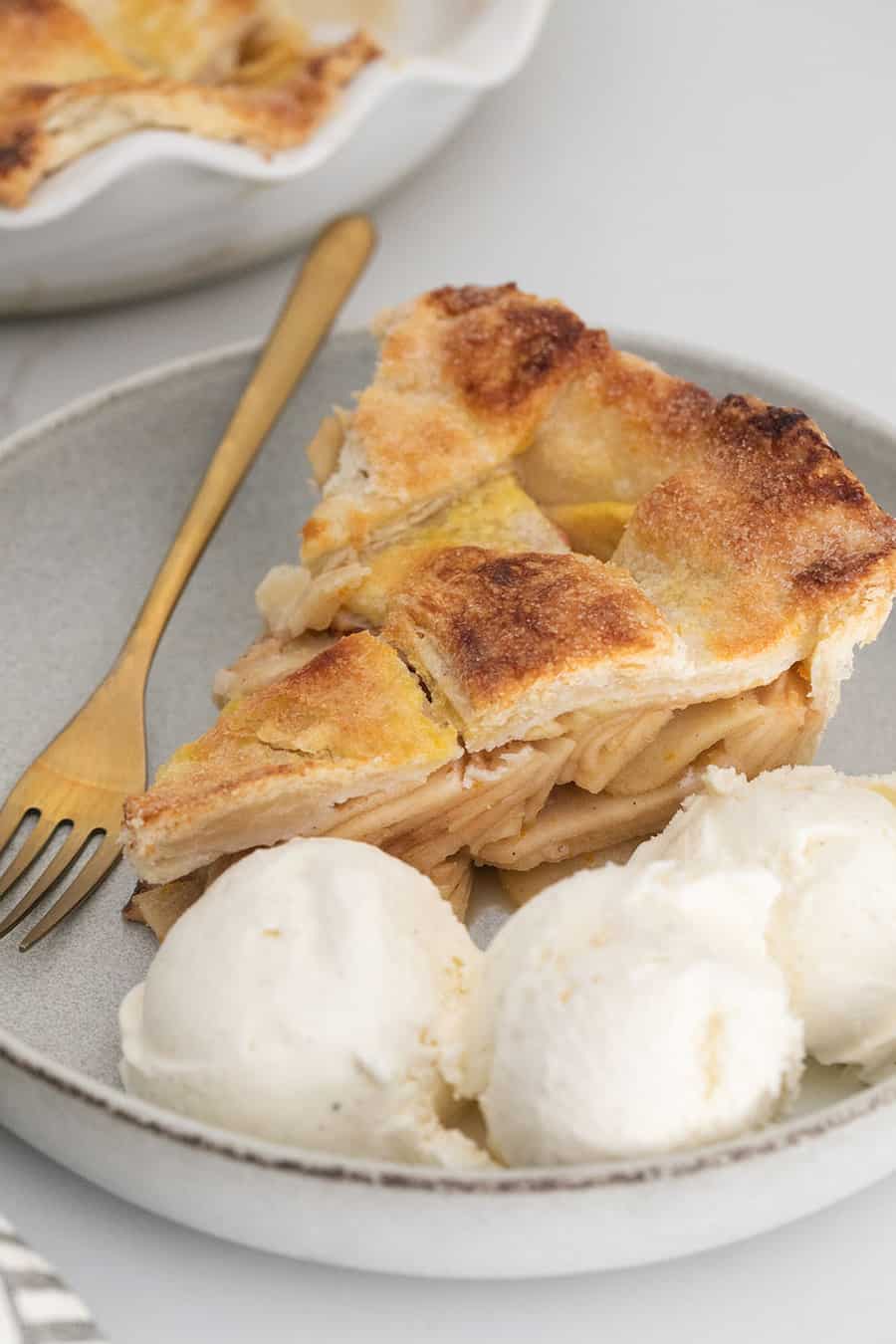 Ice cream and apple pie with thinly sliced apples