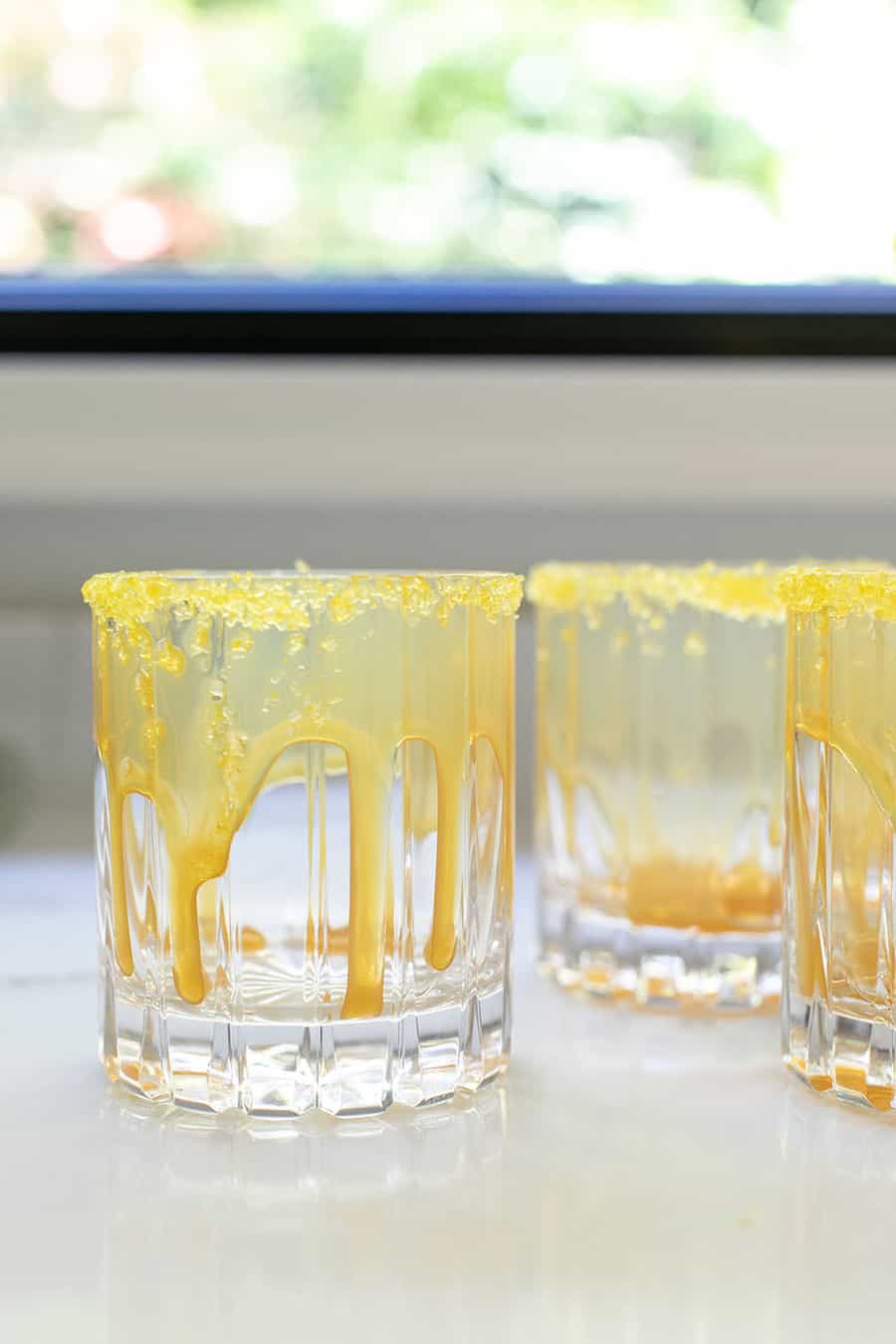 butterscotch sauce dripping down the sides of a glass