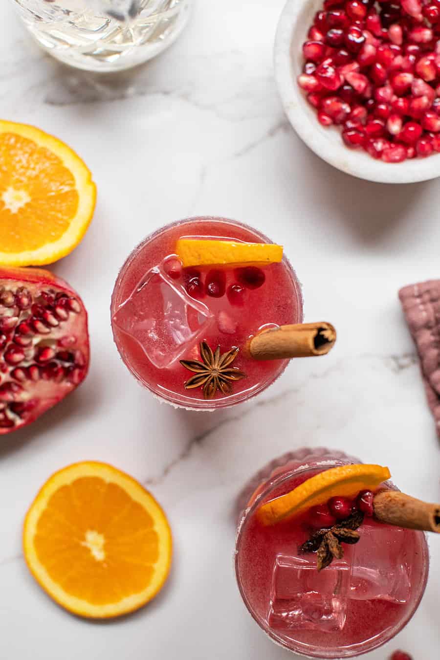 Pomegranate margaritas with cinnamon sticks and star anise.