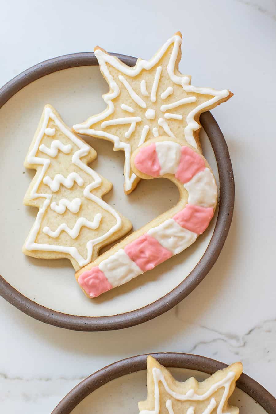 Sugar-free cookies shaped like a candy cane, Christmas tree and snowflake.