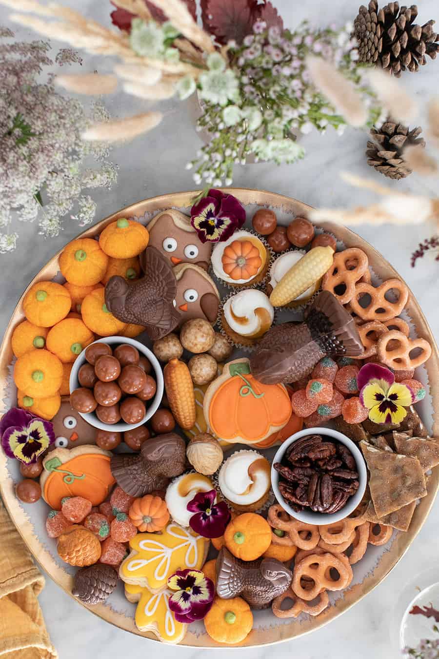 Fall party dessert platter with candy, chocolates and cookies. 