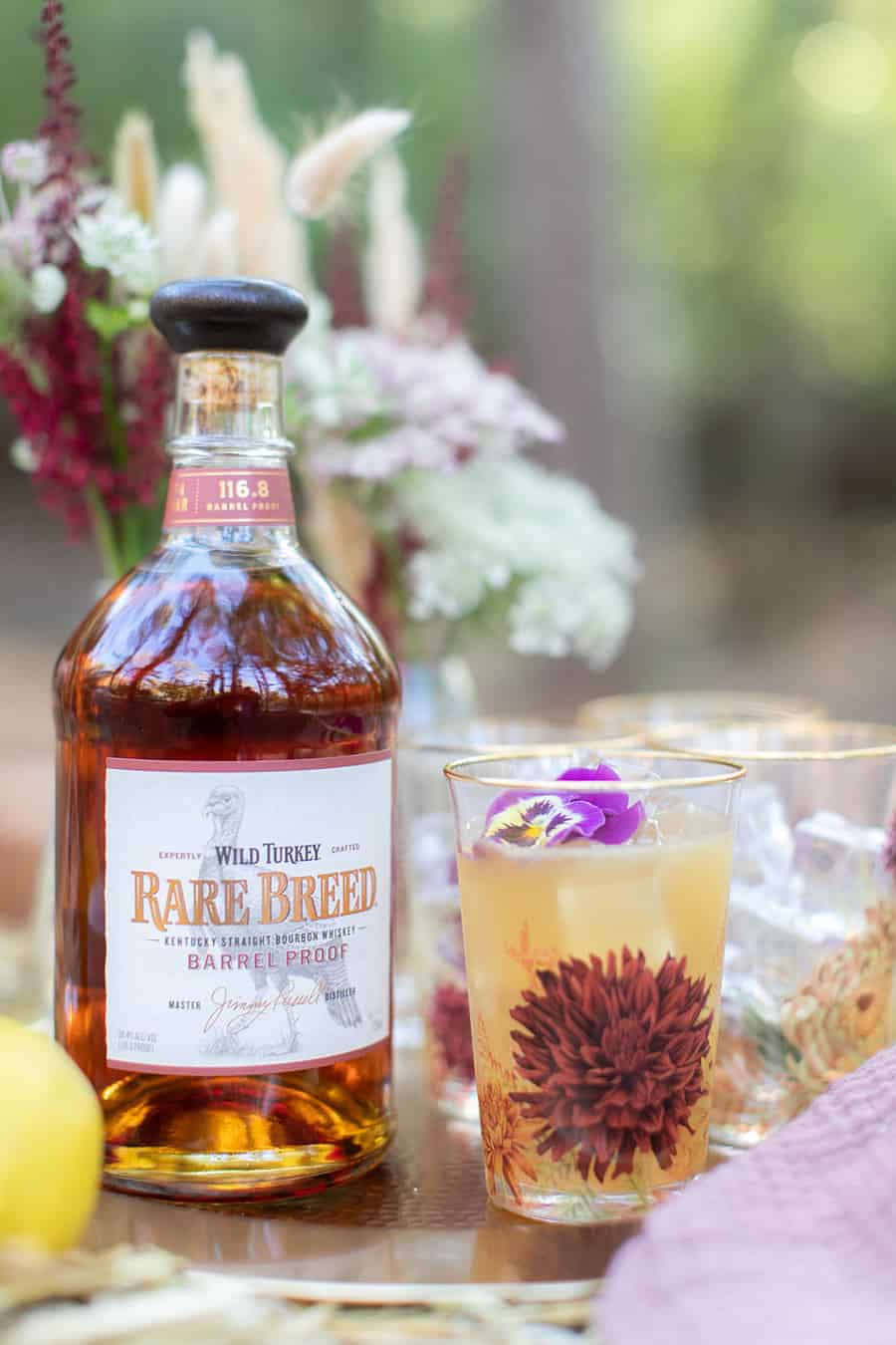 Wild Turkey Bourbon cocktail in a floral cup.