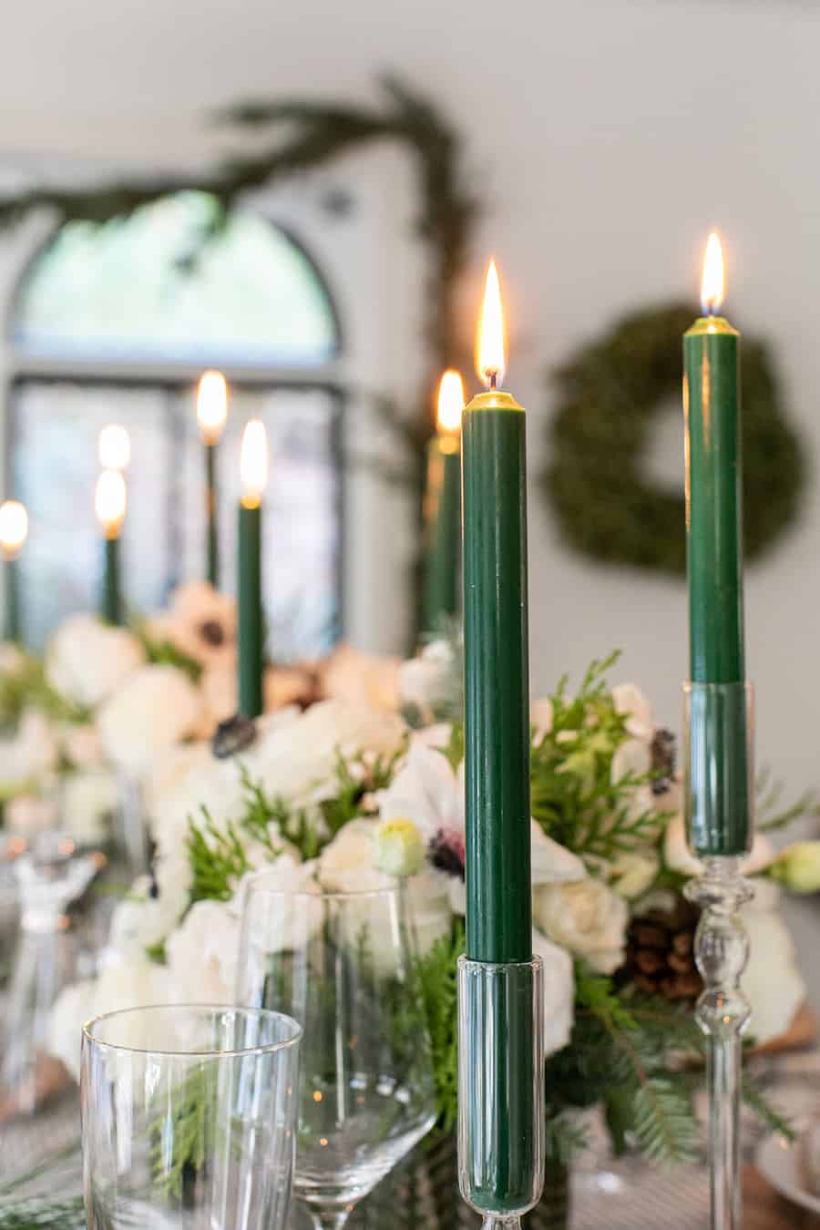 Green candles in candle holders.