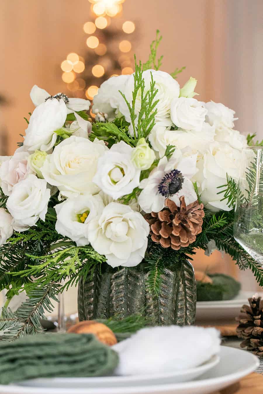 Christmas flowers in a a green Hobby Lobby vase.