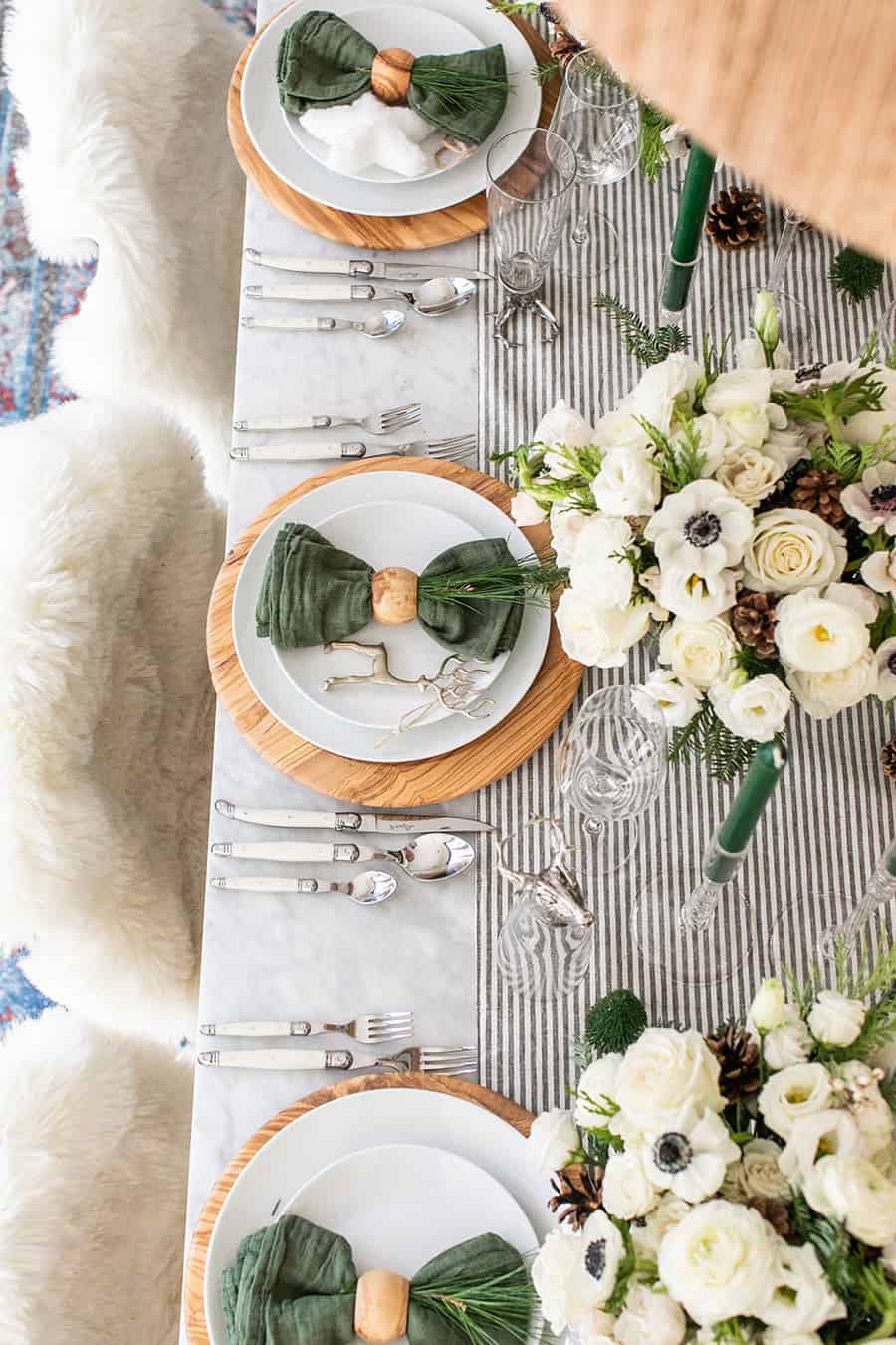 A table filled with Christmas table decorations. 