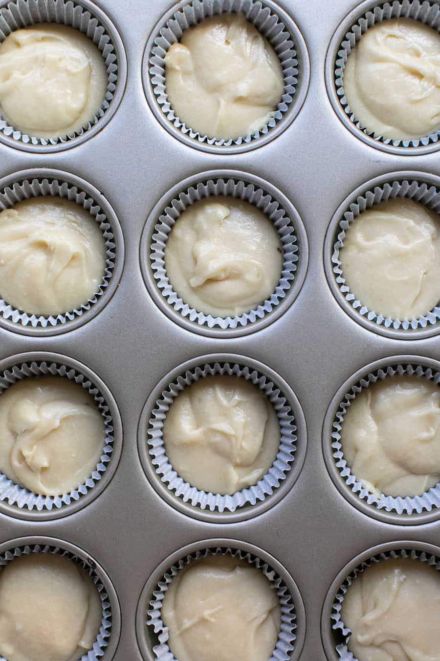 Vanilla cupcakes in tin before baked