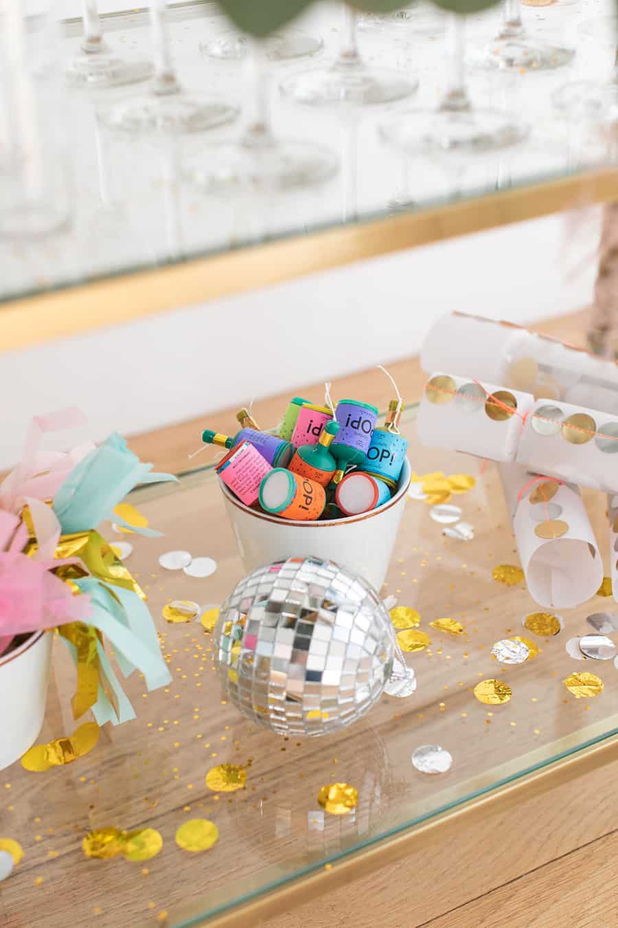 Disco ball and part poppers on a New Year's Eve Champagne Bar