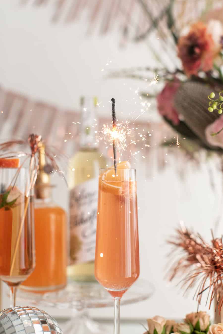 Champagne cocktail with a sparkler.