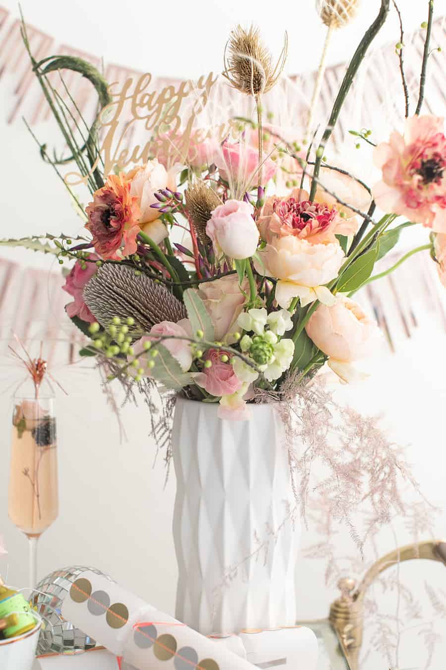 Flowers for New Year's Eve in a white vase