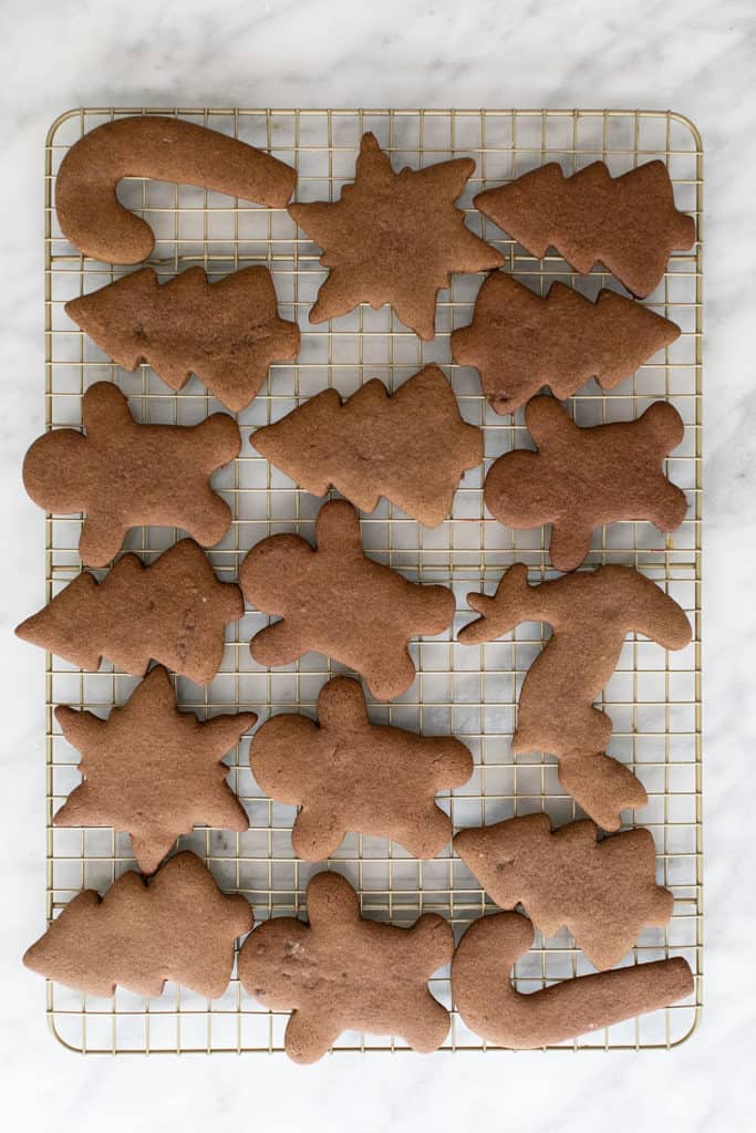 Gingerbread cookies on a cookie rack.