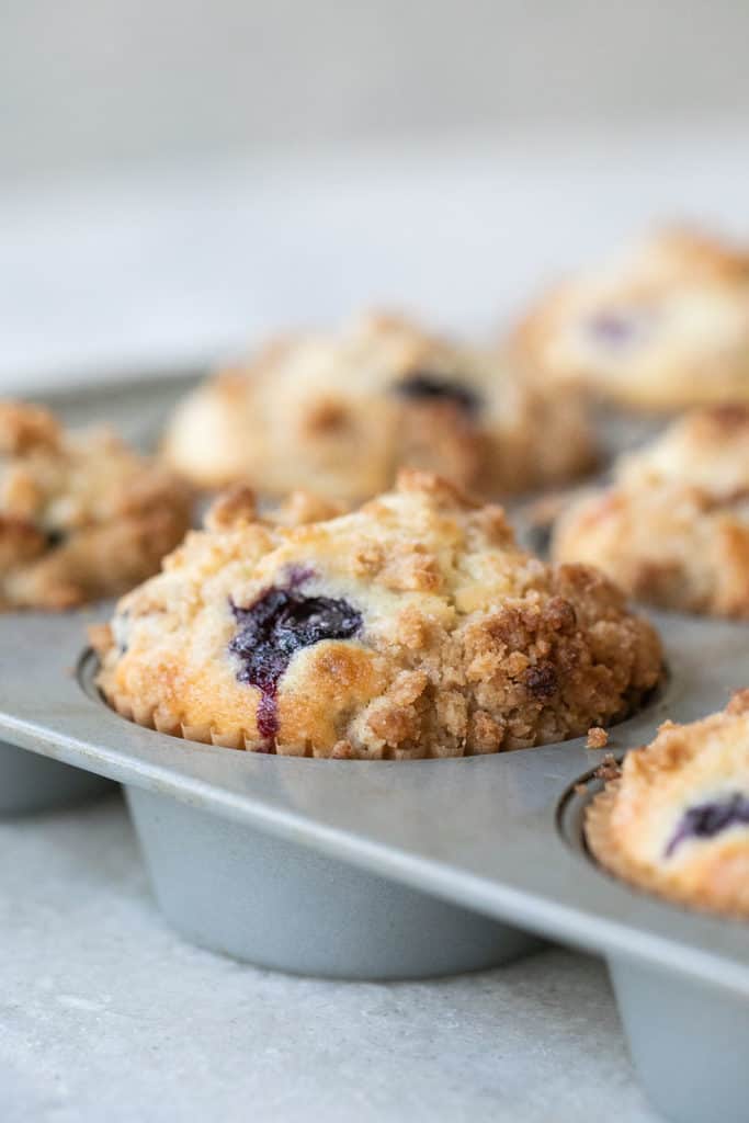 Blueberry muffins in a muffin tin.