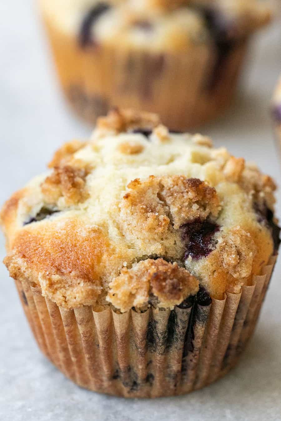 Bakery-style blueberry muffins with streusel topping.