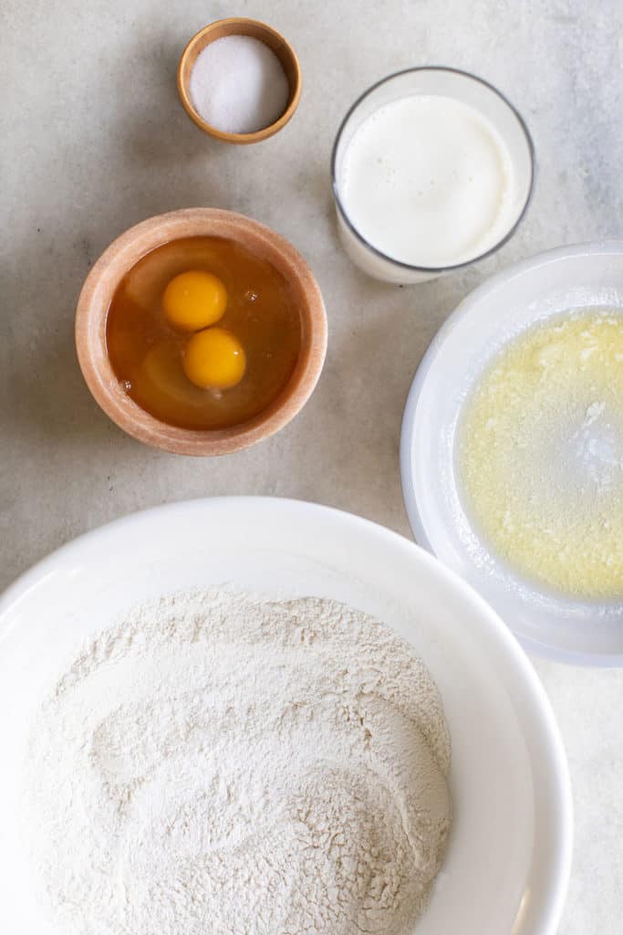 Flour, eggs, milk, butter, salt and baking powder to make pancakes