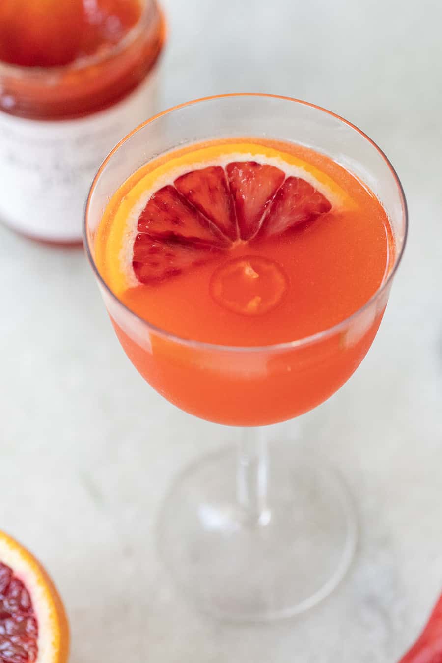 Red Pepper Jelly Cocktail with Blood Orange in a coup glass