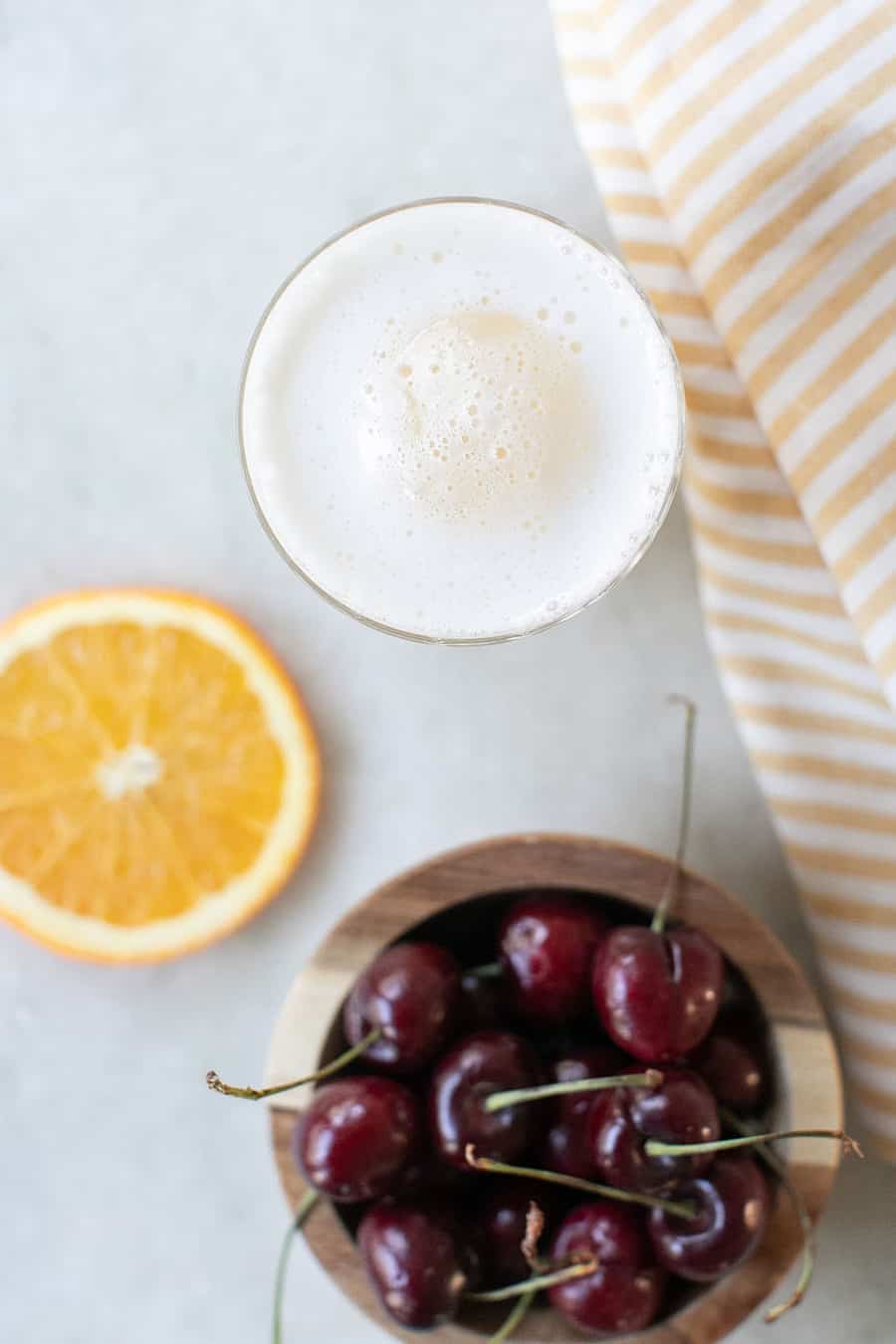 cocktail with large ice cube and egg whites 