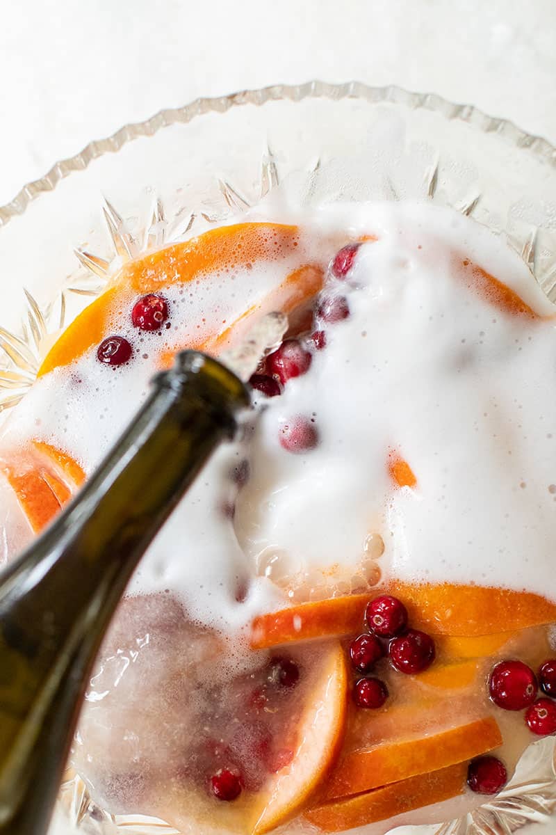 Christmas party punch recipe with Champagne, oranges and cranberry 