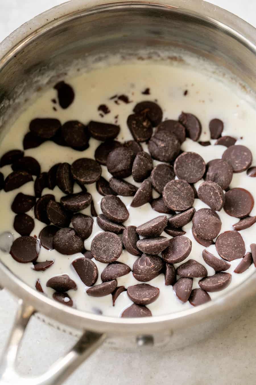 Semisweet chocolate morsels in hot heavy cream