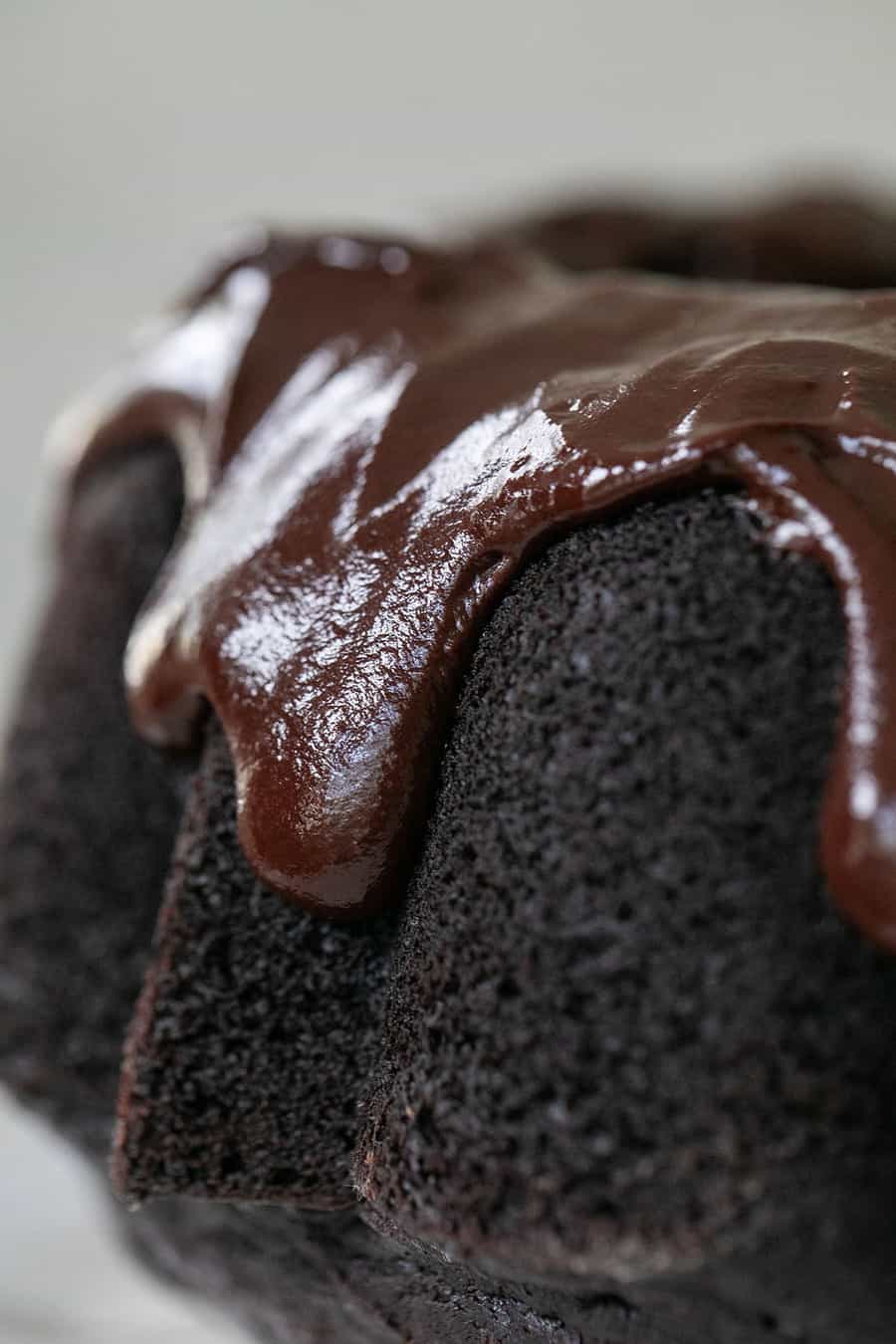 Chocolate bundt cake with dripping chocolate frosting.