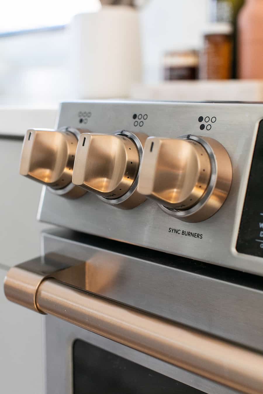 brush bronze handles on stainless steel range