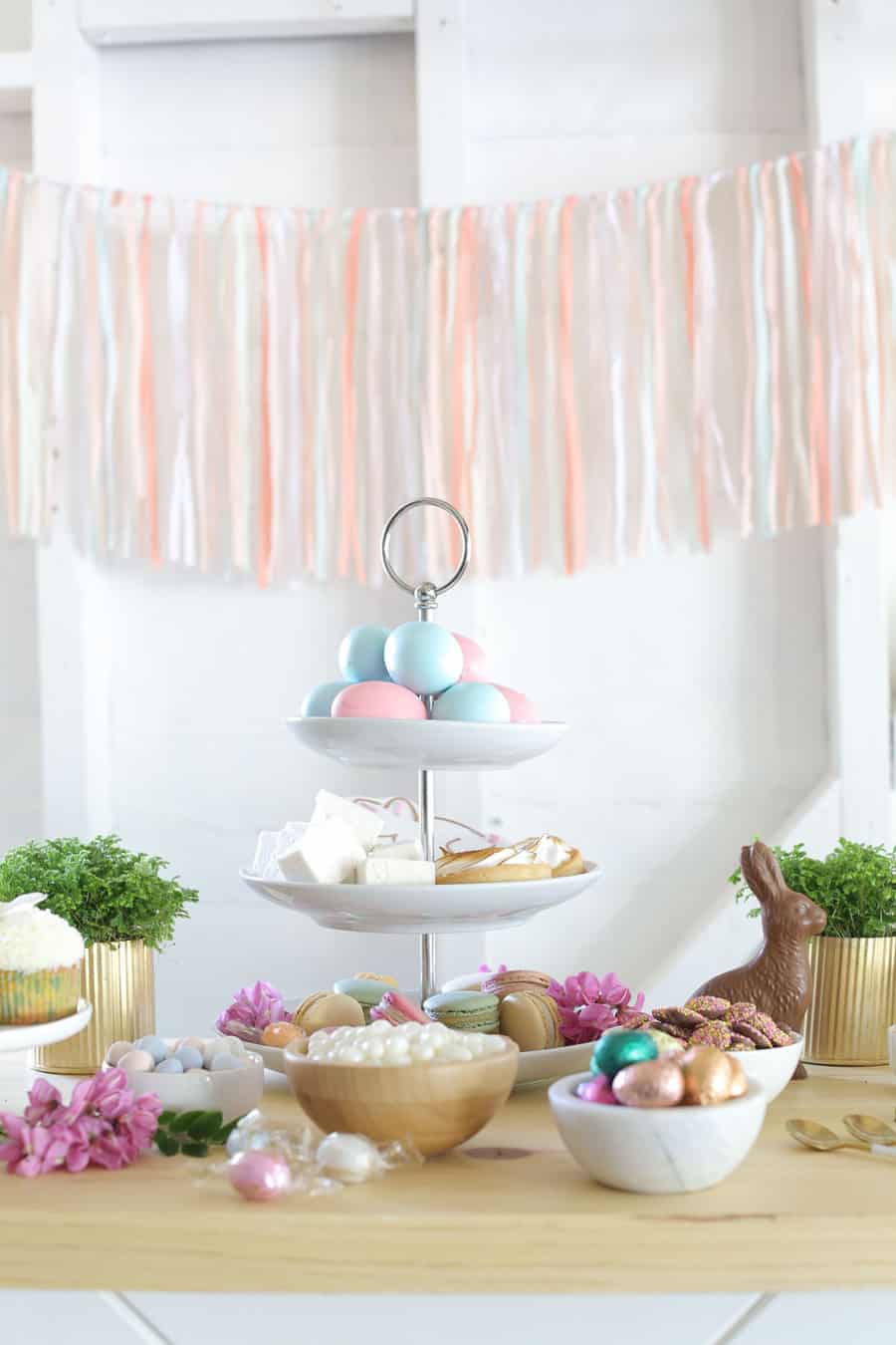 Easter dessert ideas on a table with chocolate, eggs, marshmallows.