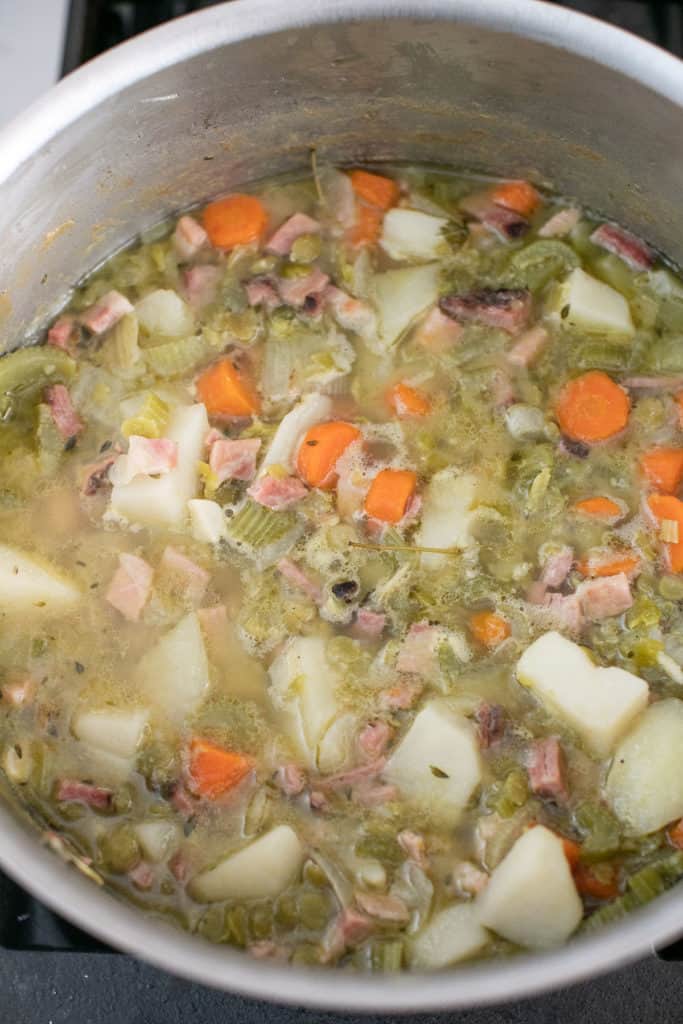 making split pea soup in a large pot