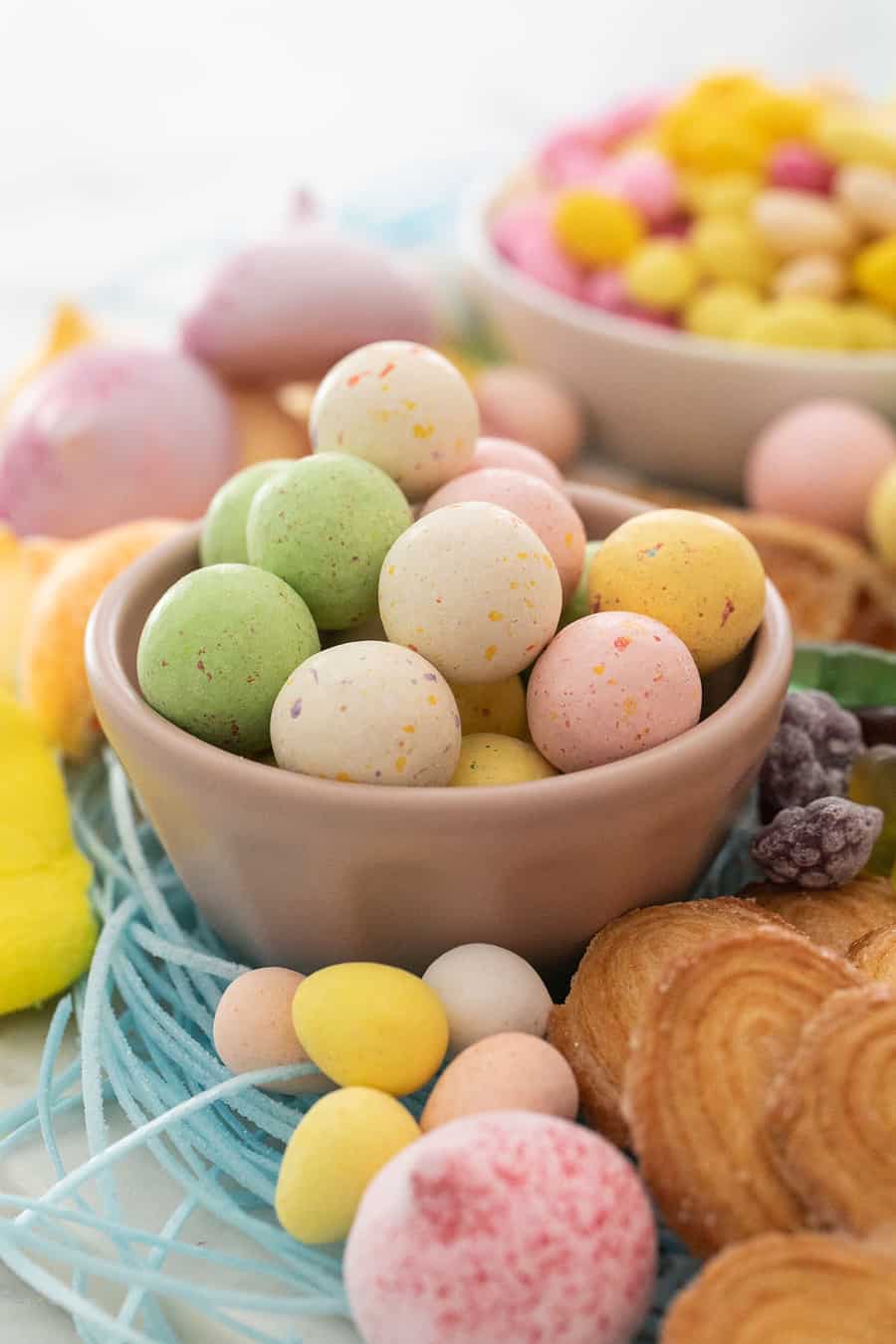 Malt balls in a small pink bowl