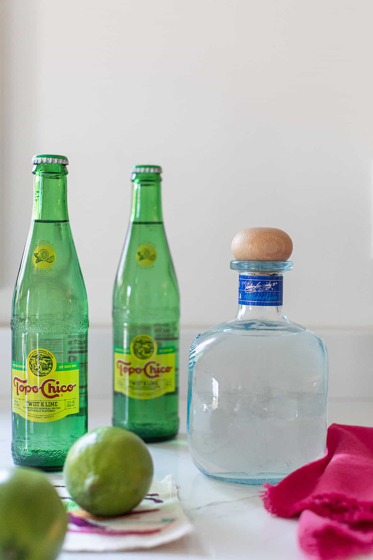 Tequila and Topo Chico with lime.