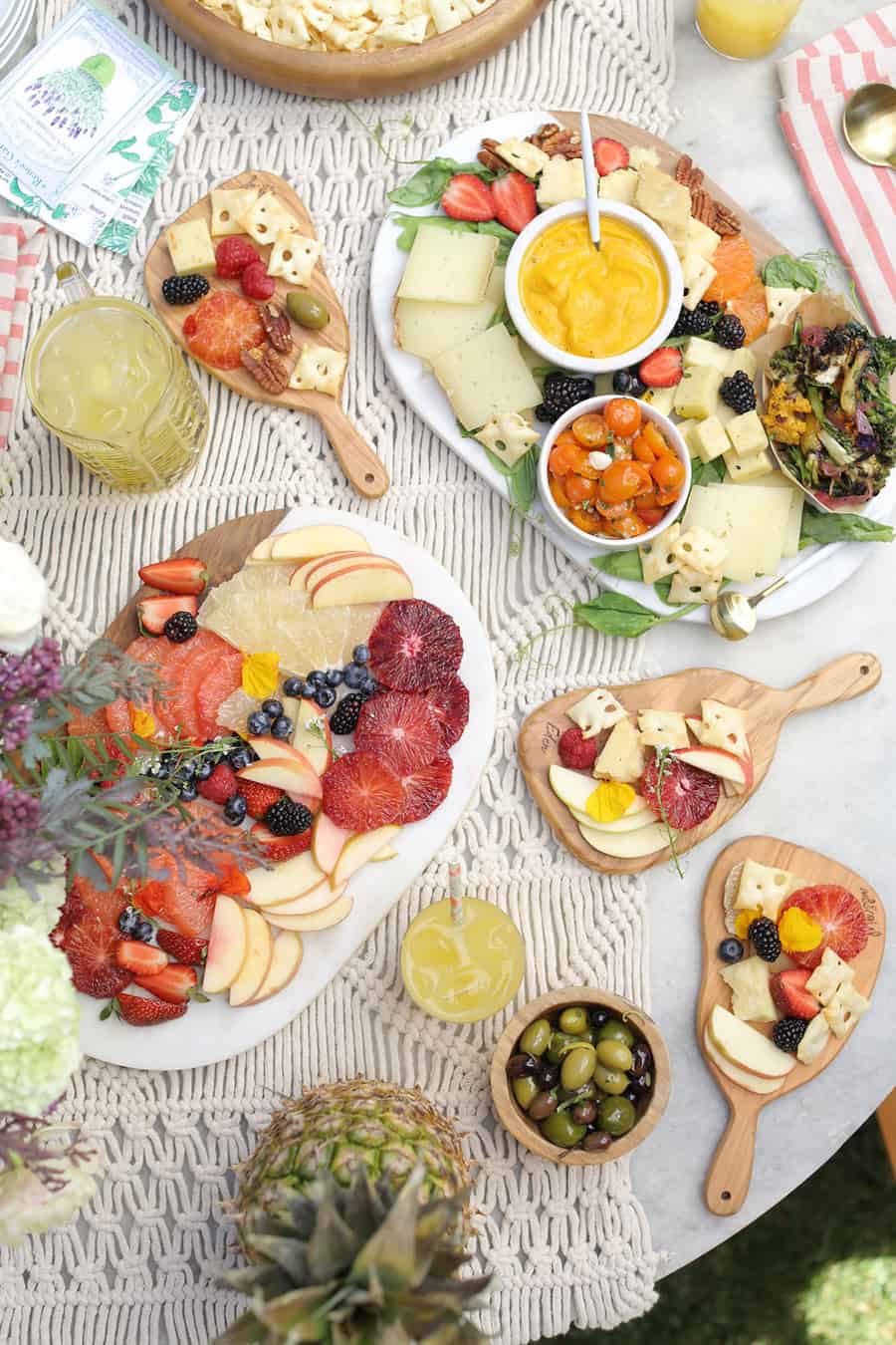 Cheese boards and snacks in a garden party setup