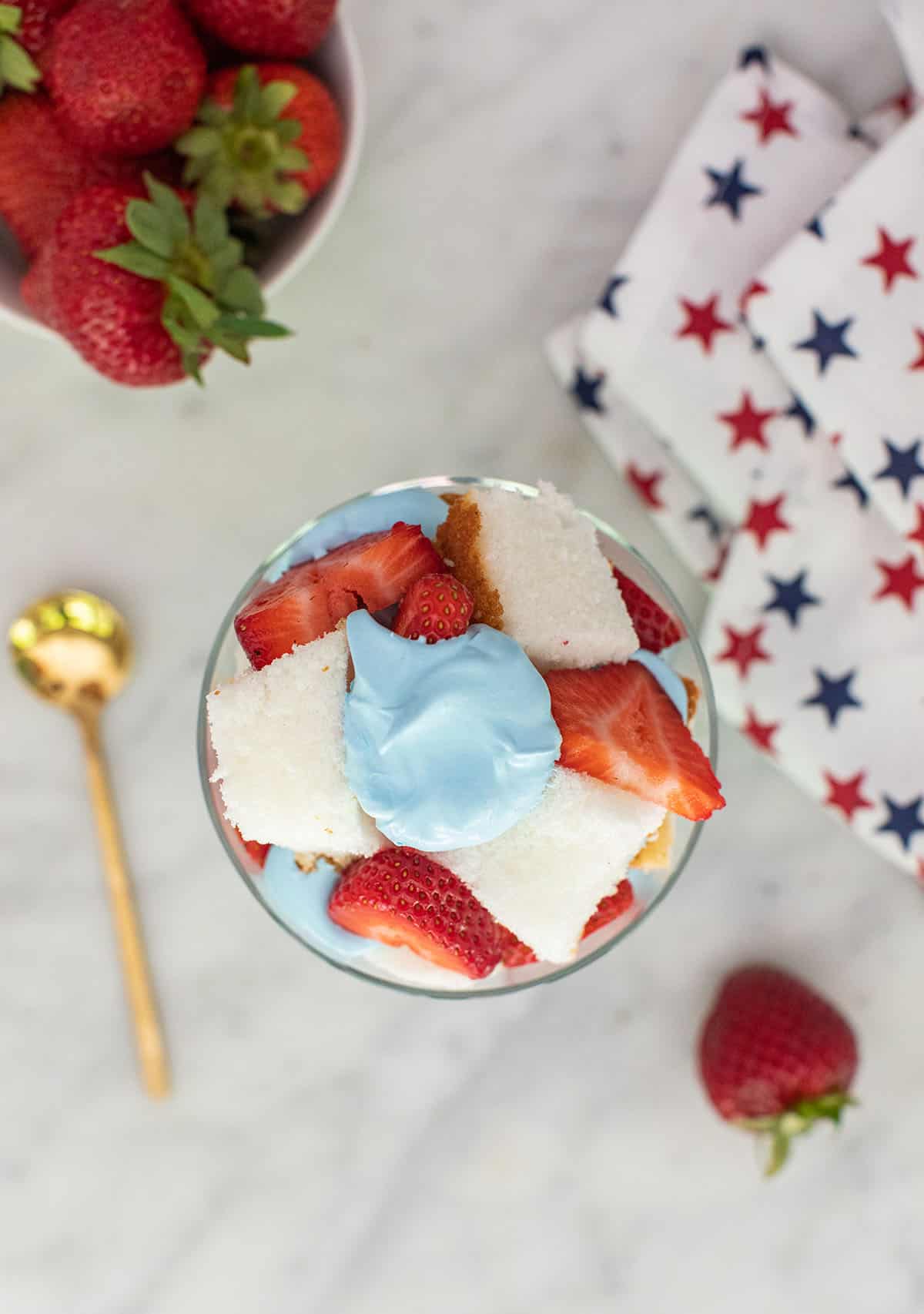 angel food cake mix dessert with strawberries and blue whipped cream 